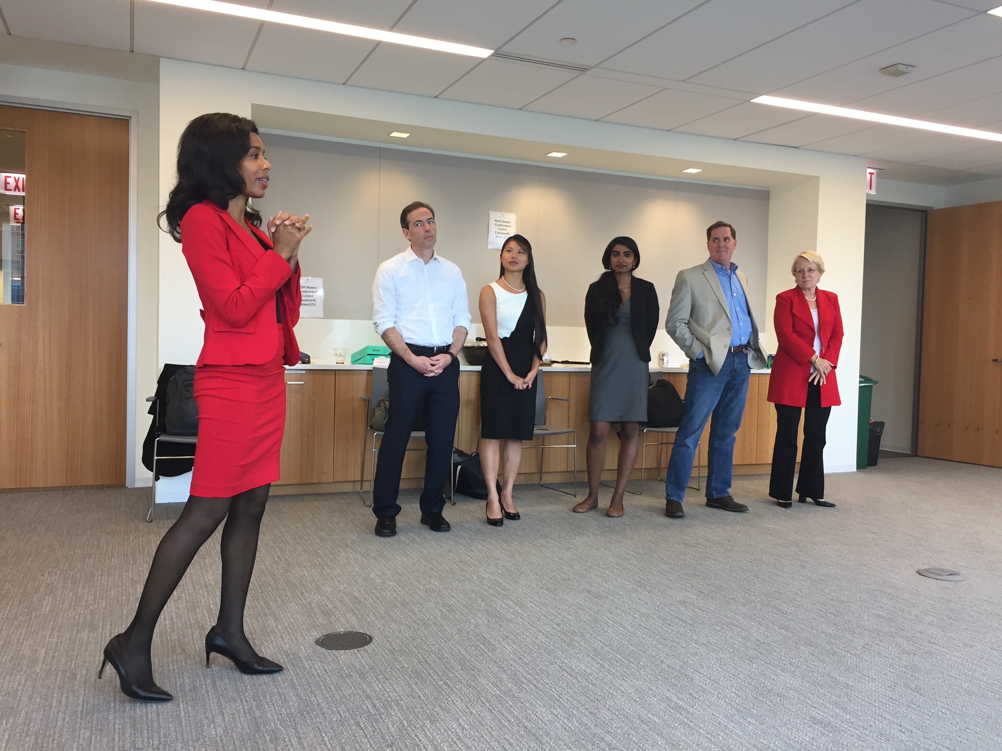 Woman presenting to business team